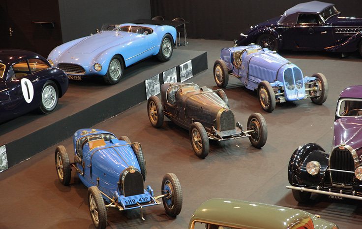 Bugatti racing cars and a light blue sports car, 2015